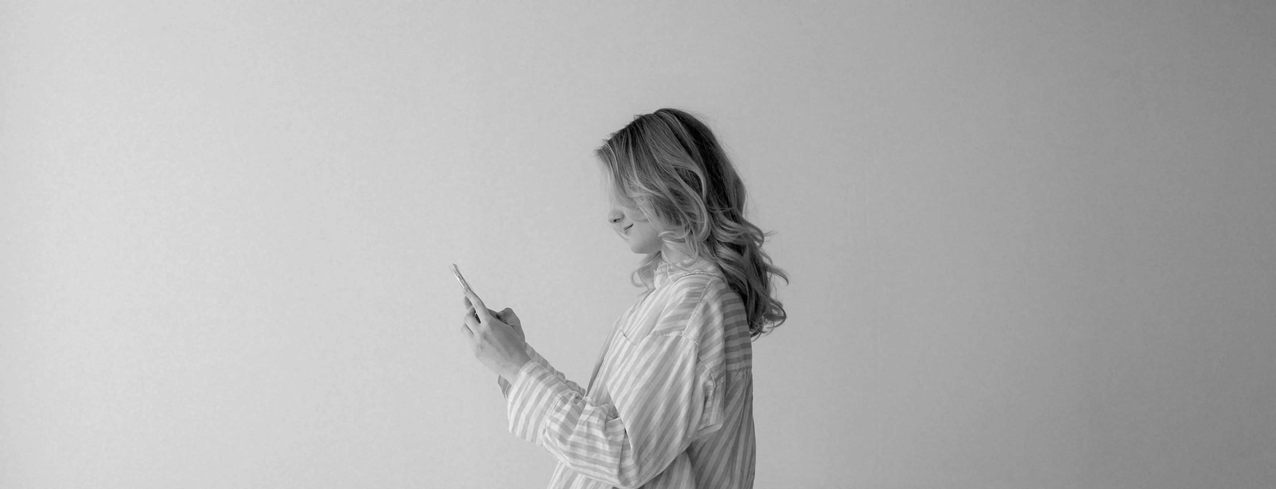 A woman holding a mobile phone