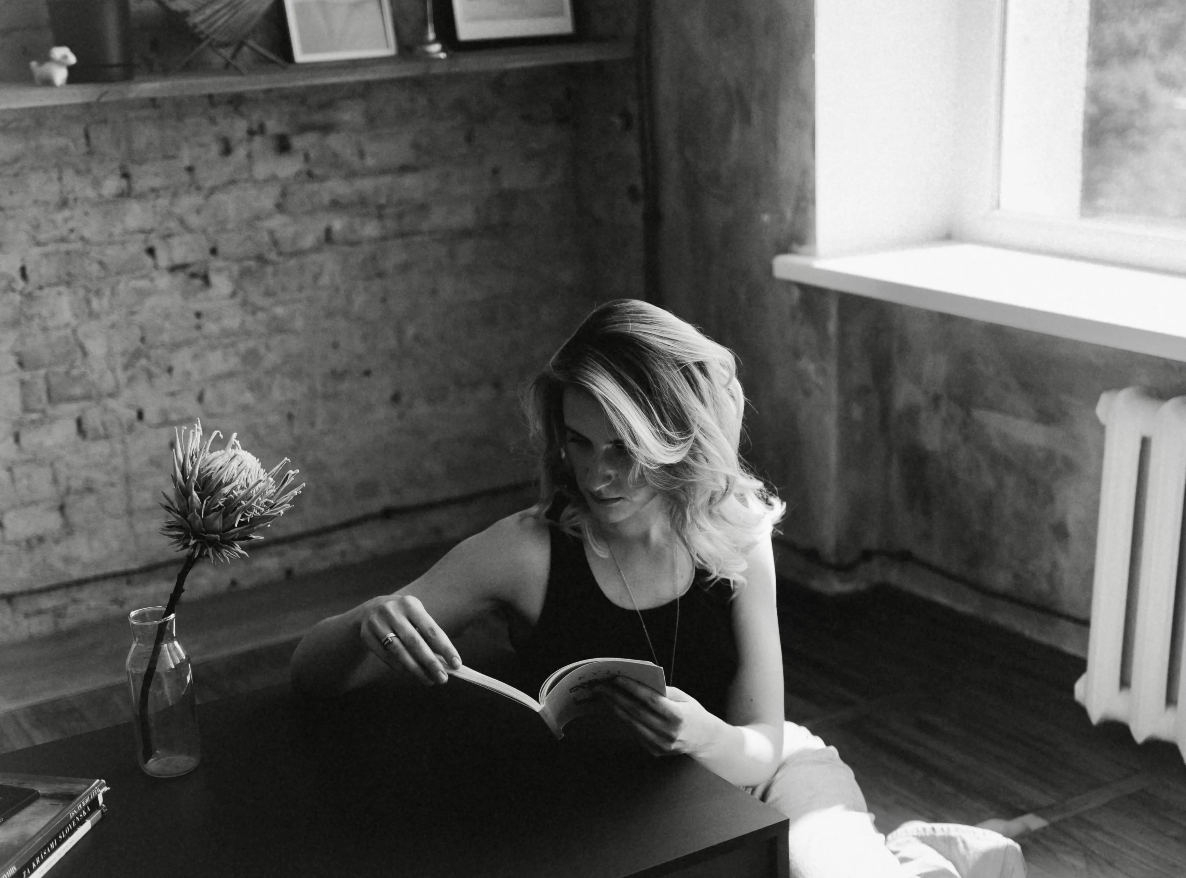 A woman reading a book without eye-contact